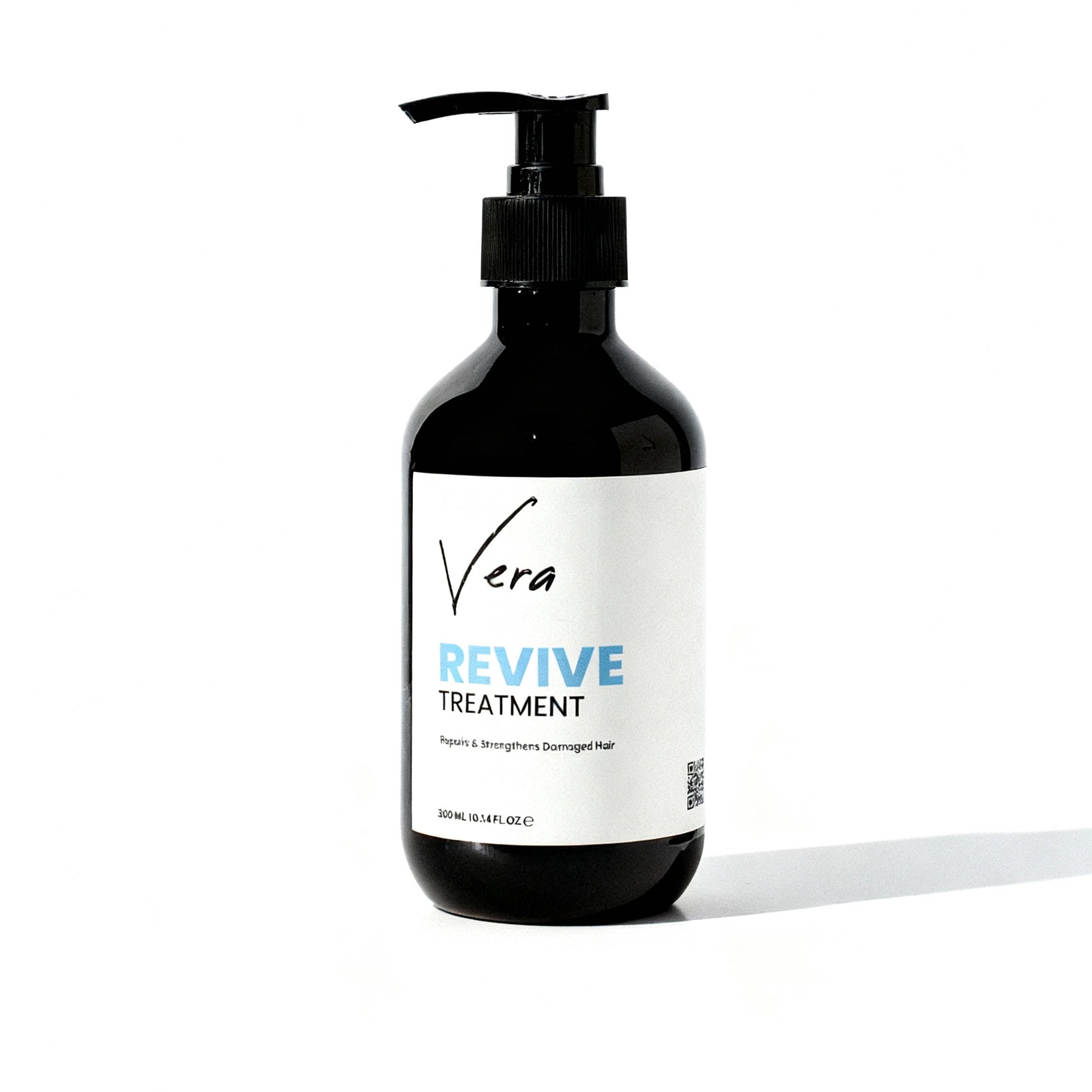 Hair_treatment_bottle_Edit_the_uploaded_photo_of_the_Vera_Revive_Treatment_bottle_to_match_the_lighting_background_and_mood_of_my_reference_product_photo._Keep_the_bottle_pump_and_lab_2687dd0e-bdec-4954-a07d-0edb40161830.jpg